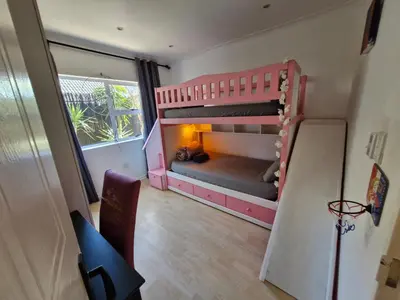 a room with two bunk beds in a room at Regent Casa's - Cape Towns Blouberg Area - Where 20 people can stay in Cape Town