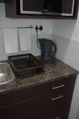 a kitchen counter with a stove and a sink at 105 on Sarel Cilliers in Strand