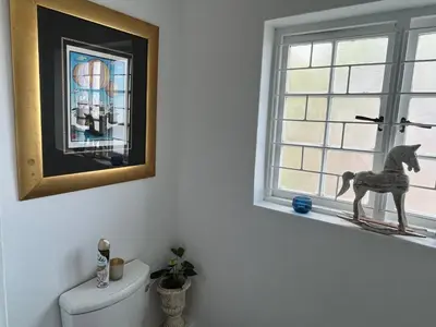 a bathroom with a toy horse on a window sill at Somerset West All Stay 2 in Somerset West