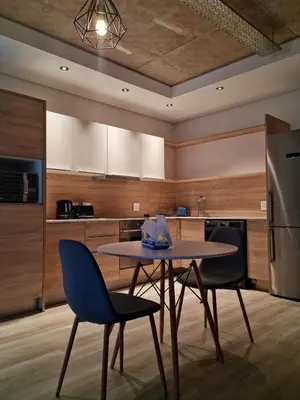 a kitchen with a table and two chairs at Matrix by Smart City Stays in Cape Town