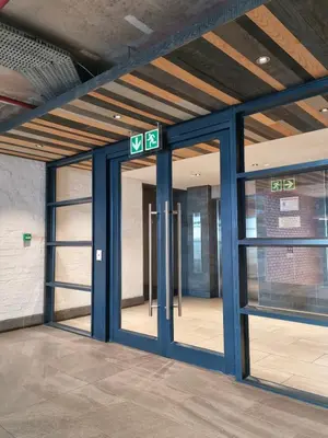 an entrance to a building with blue doors at Matrix by Smart City Stays in Cape Town
