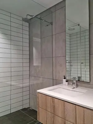 a bathroom with a sink and a mirror at Matrix by Smart City Stays in Cape Town