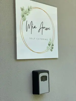 a picture of a sign on a wall with a lightswitch at Mia Amore in Caledon