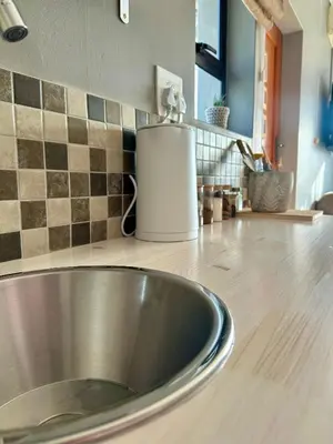 a kitchen counter with a metal sink in a kitchen at Mia Amore in Caledon