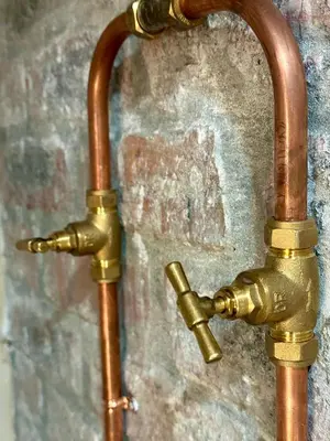 a brass water hose attached to a wall at Mia Amore in Caledon