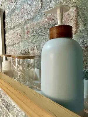 a bottle of soap sitting on top of a shelf at Mia Amore in Caledon