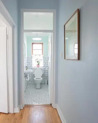 a bathroom with a white toilet and a mirror at Boho Chic Apartment Stellenbosch in Stellenbosch