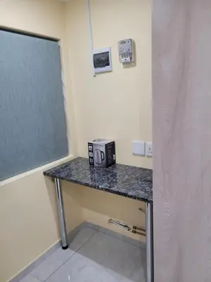 a table in a room with a black counter top at MIRAJO Guest House in Cape Town
