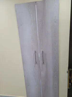 a metal door with a curtain in a room at MIRAJO Guest House in Cape Town