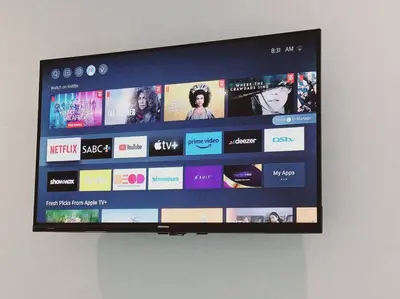 a flat screen tv hanging on a wall at Charm Nest - Uncapped Wi-fi & Self Check-in in Cape Town