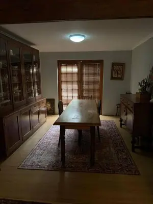 a dining room with a wooden table in a room at 5 BEDROOM CAPE TOWN FAMILY HOME PET FRIENDLY in Cape Town
