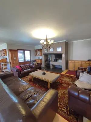 a living room with a couch and a coffee table at 5 BEDROOM CAPE TOWN FAMILY HOME PET FRIENDLY in Cape Town
