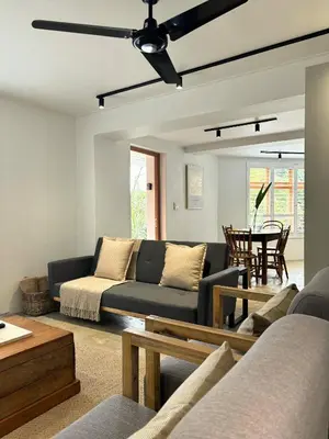 a living room with a couch and a table at The Paarl Grand in Paarl