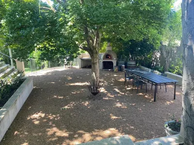 a park with a picnic table and a tree at Auret Street Garden Cottage in Paarl