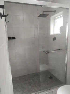 a shower with a glass door in a bathroom at Harmonie Self Catering in Wolseley