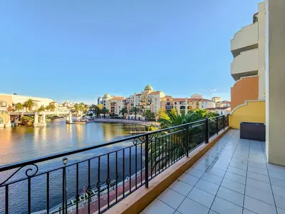 a balcony with a view of a river and buildings at Family-Friendly Home with Ample Space in Cape Town