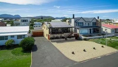 an aerial view of a house with a driveway at Mafari Beach House in Hermanus