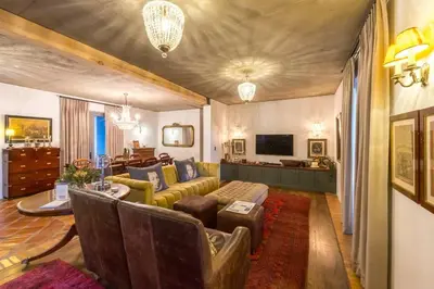 a living room with a couch and a table at Serendipite Villa in Franschhoek