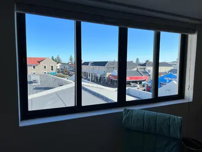 a window in a room with a view of a street at Waterfront Studio apartment no 5 in Hermanus