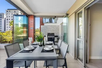 a dining room with a table and chairs at Mayfair Luxury 212 by Host Agents in Cape Town