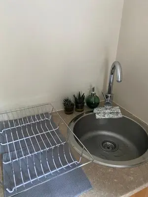 a kitchen sink with a metal sinkstration istgternessternessternessternessstrationstrationterness at Big room in Stellenbosch in Stellenbosch
