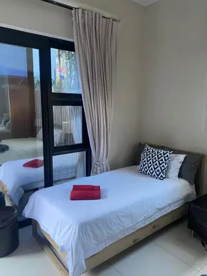 a bedroom with two beds and a window at Big room in Stellenbosch in Stellenbosch