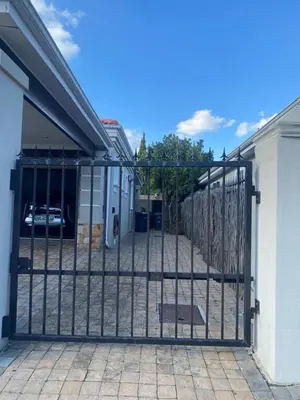 a gate in front of a building at Big room in Stellenbosch in Stellenbosch