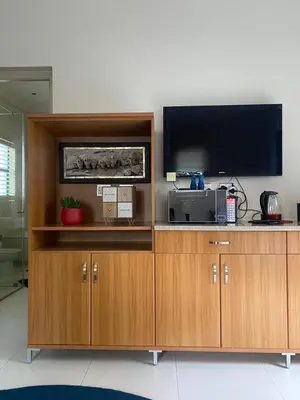 a large entertainment center with a flat screen tv at Big room in Stellenbosch in Stellenbosch