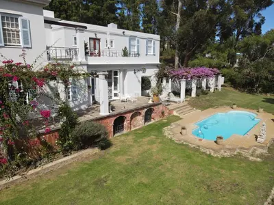 a house with a swimming pool in the yard at Morton Manor in Somerset West