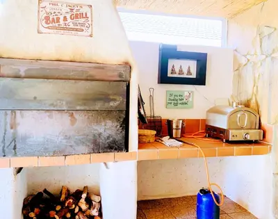 a kitchen with a counter and a grill in a room at Spacious home in Cape Towns Blouberg area in Cape Town