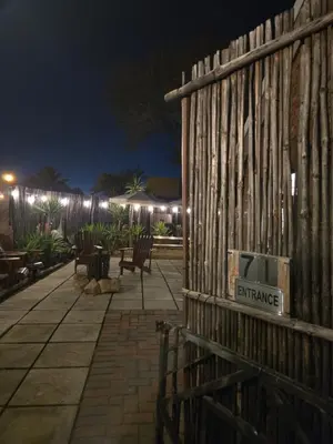 a fence with a sign that says entrance on it at Apartment with garden in Cape Town