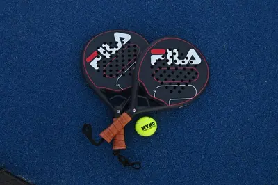 a tennis racket and a ball on a table at Fransvliet Guest House in Franschhoek