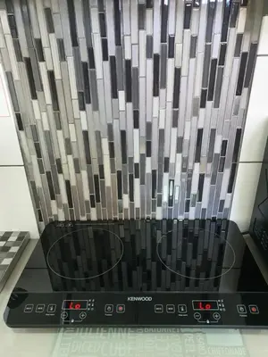 a laptop computer sitting on top of a counter at OysterCatcher Self-Catering Accommodation Strand in Cape Town