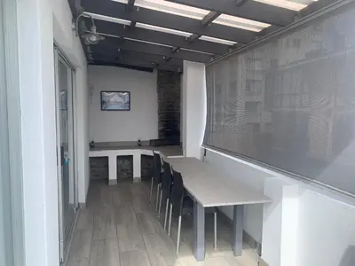 a dining room with a table and chairs at OysterCatcher Self-Catering Accommodation Strand in Cape Town