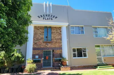 a building with a sign that reads breaker flats at Ebenezer in Somerset West