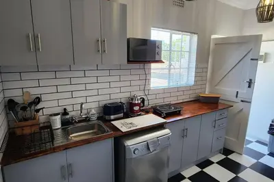 a kitchen with a sink and a dishwasher at Ebenezer in Somerset West