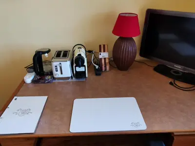 a desk with a laptop and a monitor and a lamp at Somerset Grace Double en-suit in Somerset West