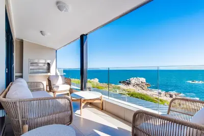 a room with a view of the ocean at The W-Collection Esplanade Hermanus in Hermanus