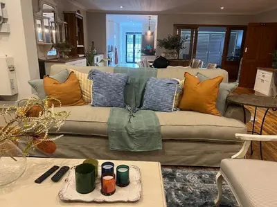 a living room with a couch with pillows on it at 7de Hemel Paarl in Paarl