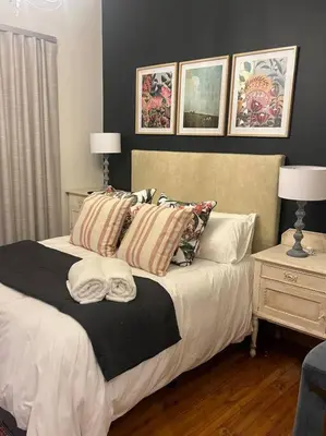 a bedroom with a bed with pillows on it at 7de Hemel Paarl in Paarl