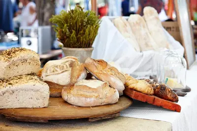 a plate of breads and pastries on a table at La Clé Village in Franschhoek