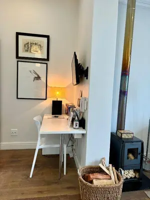 a room with a white desk and a stove at Tuishuisie in Stellenbosch