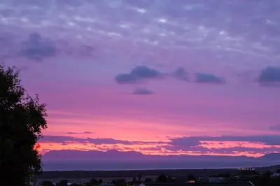 a sunset with a purple and pink sky at Majorca House in Somerset West