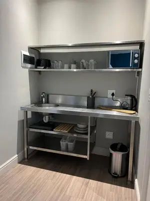 a kitchen with a sink and a counter top at Hermanus Waterfront Apartment no 17 in Hermanus