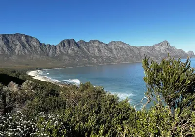 a view of a beach with mountains in the background at Happy Place Pringle Bay in Pringle Bay