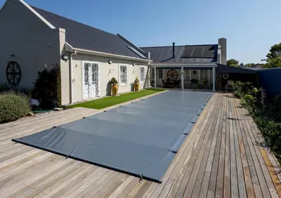 a largesteel mat on a deck in front of a house at Pelicans Nest in Onrus in Hermanus