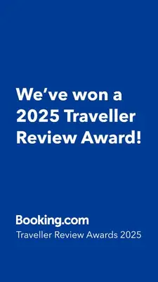 a blue sign that says weve won a traveler review award at Blouberg Studio in Cape Town