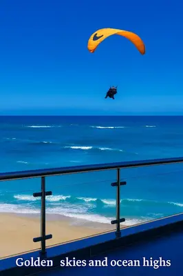 a person flying a parachute over the ocean at Beachfront Luxury Apartment - Hibernian Towers 309 Strand - Self Catering in Cape Town