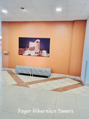 a wall with a tv on a wall in a room at Beachfront Luxury Apartment - Hibernian Towers 309 Strand - Self Catering in Cape Town
