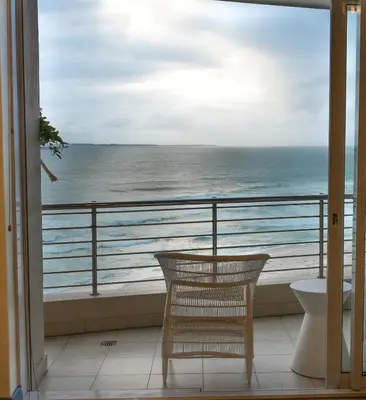 a balcony with a view of the ocean at Portico 1002 in Cape Town